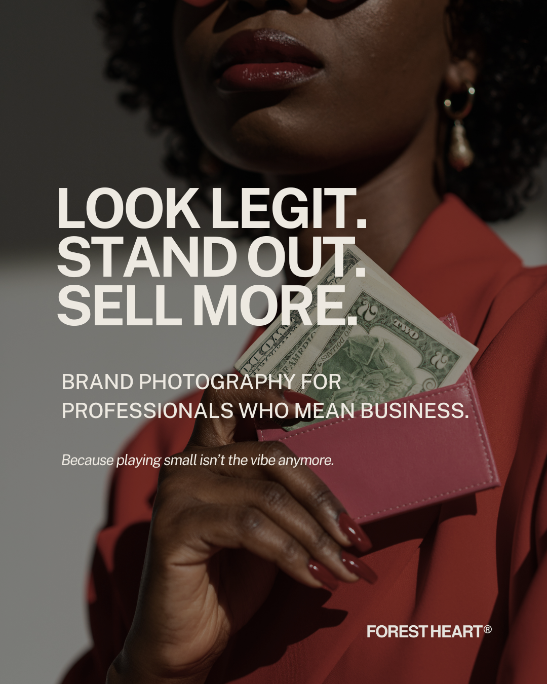Confident Black woman in red suit holding a pink wallet with cash, representing bold, high-end brand photography for professionals