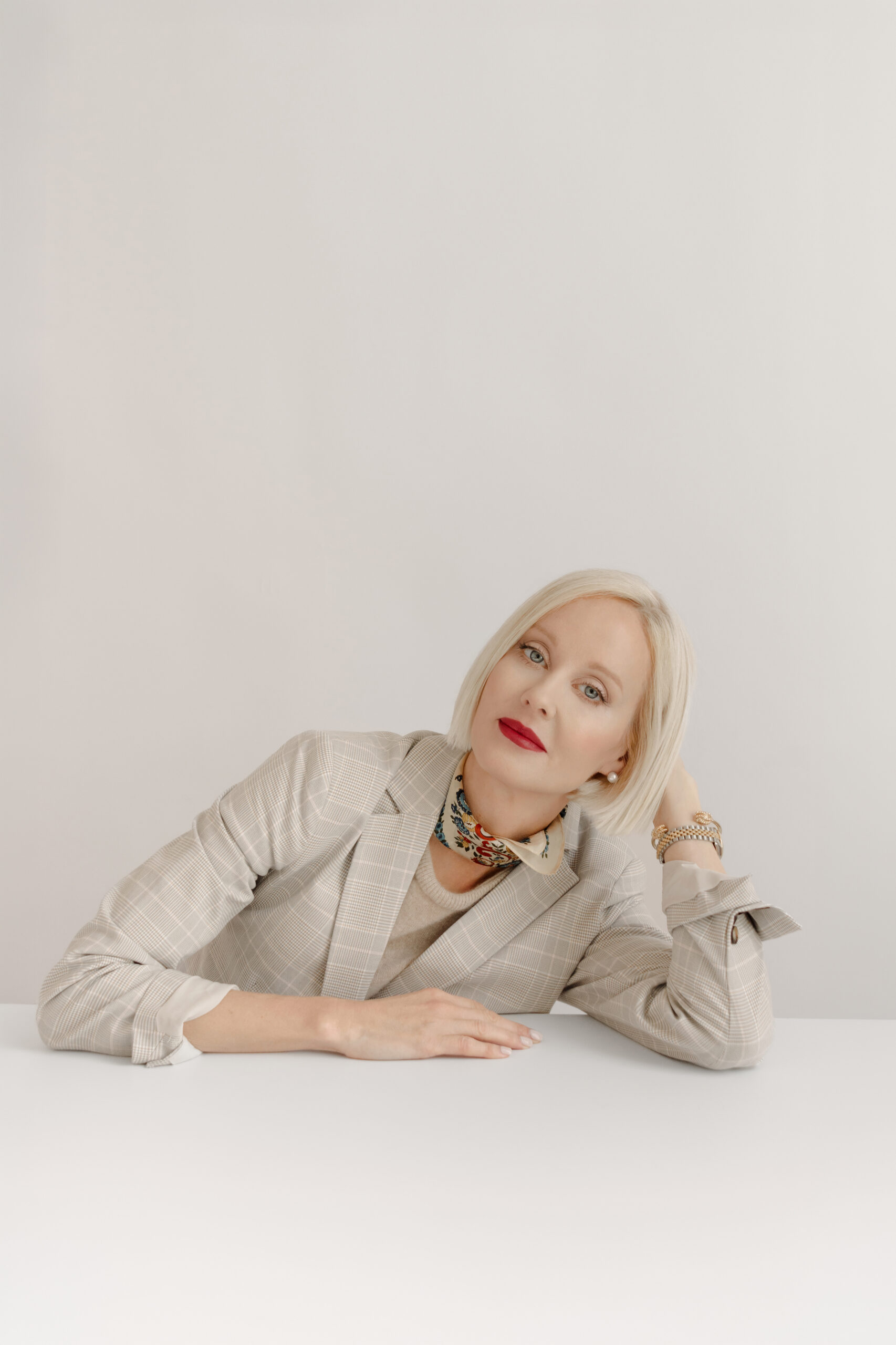 branding photoshoot session showing relaxed natural posing with neutral styling in studio